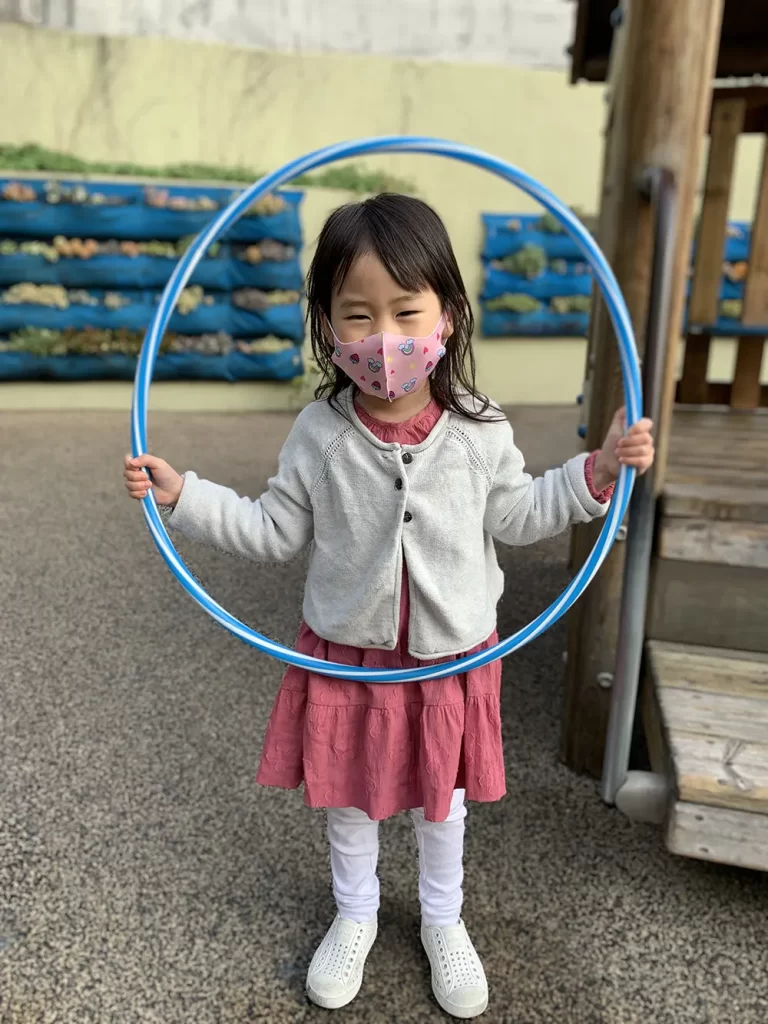 Preschooler Holding Hula Hoop