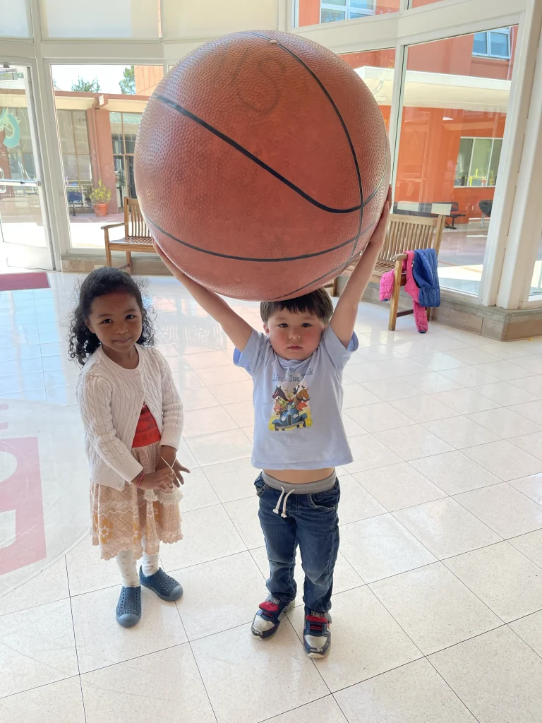 Preschooler holding a ball