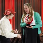 CAIS Founder Carol Ruth Silver presents Heart of CAIS Award to former Board Chair Mary Powell